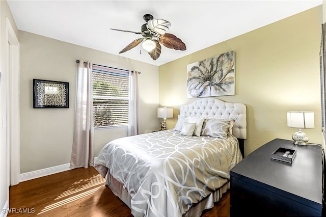 bedroom featuring ceiling fan and dark hardwood / wood-style flooring