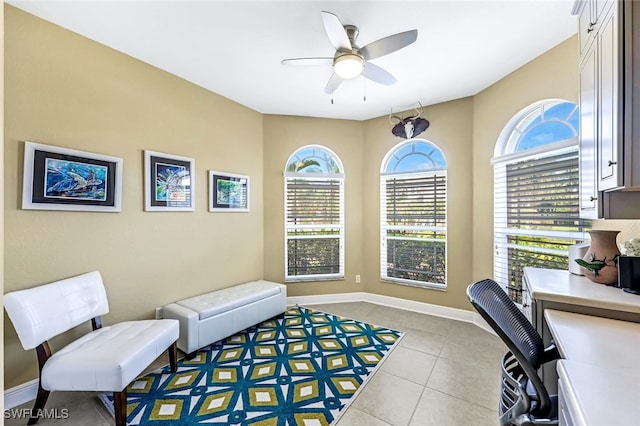 office space featuring ceiling fan and light tile patterned floors