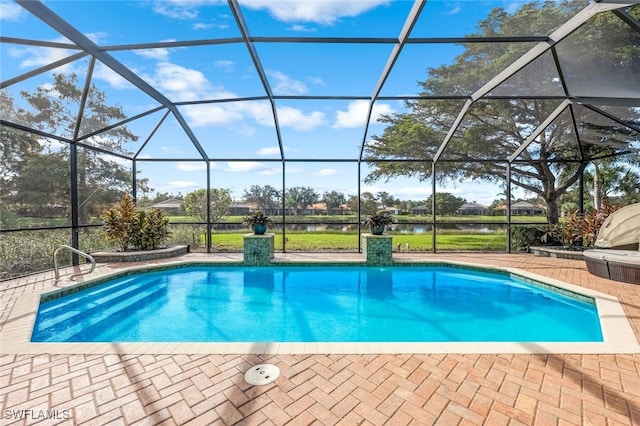 view of pool with a lanai, a water view, and a patio