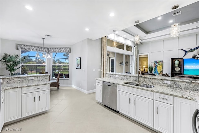 kitchen featuring stainless steel dishwasher, white cabinets, and sink