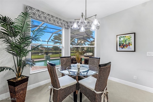 tiled dining space featuring an inviting chandelier