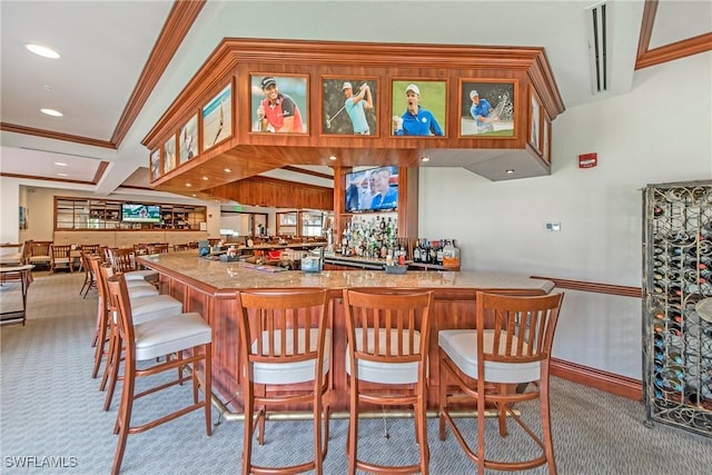 bar featuring crown molding and light colored carpet