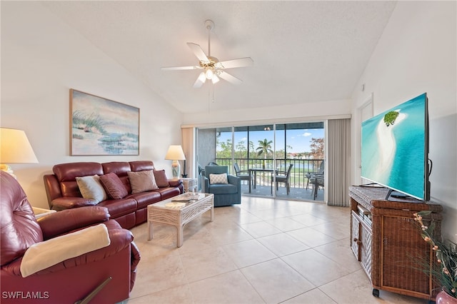 tiled living room featuring high vaulted ceiling and ceiling fan