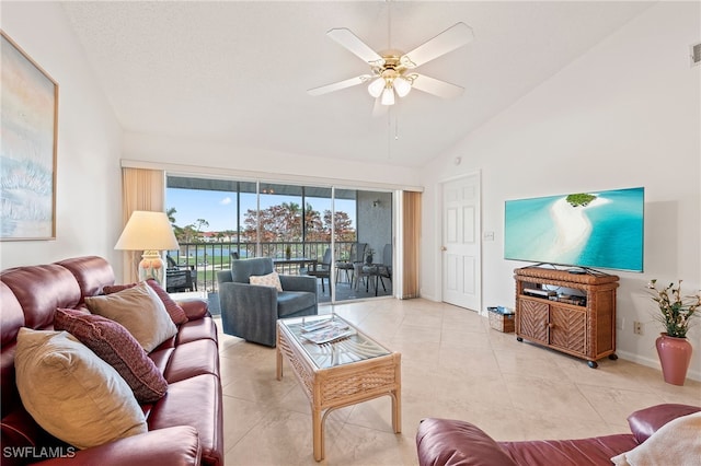 tiled living room featuring lofted ceiling and ceiling fan