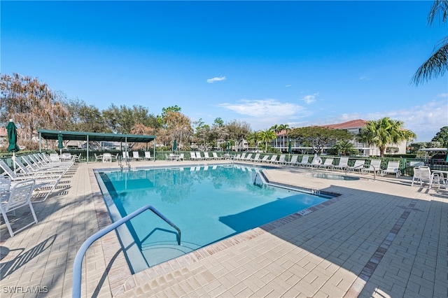 view of swimming pool with a patio