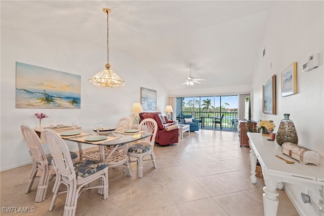 dining space featuring high vaulted ceiling, a ceiling fan, baseboards, and light tile patterned floors