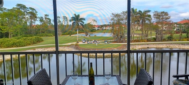 balcony featuring a water view