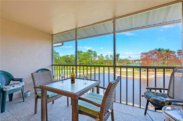 sunroom with a water view