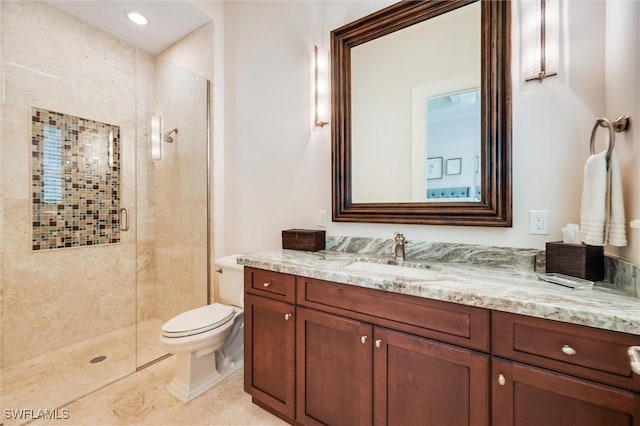 bathroom with toilet, tile patterned flooring, an enclosed shower, and vanity