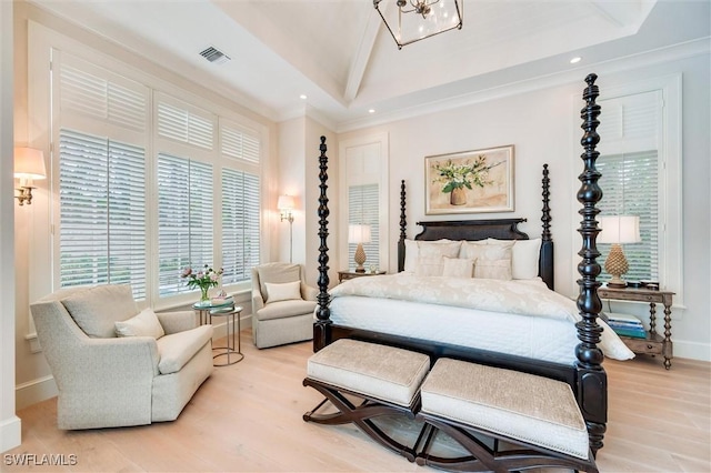 bedroom with light hardwood / wood-style floors and crown molding