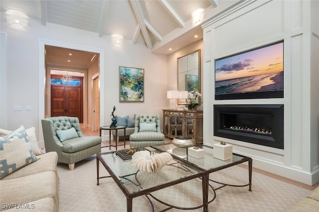 living room with vaulted ceiling with beams