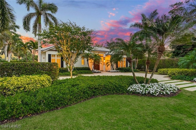 view of front of property with a yard