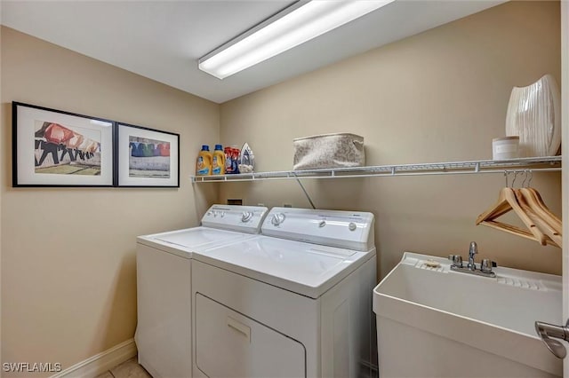 laundry room with sink and washing machine and dryer