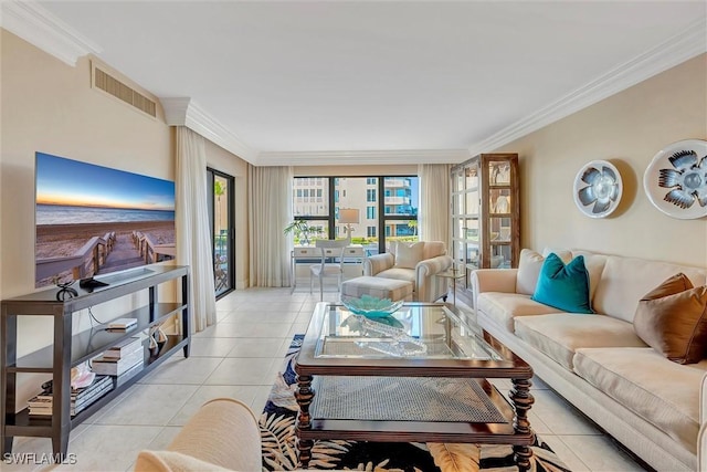 living area featuring visible vents, crown molding, and light tile patterned floors