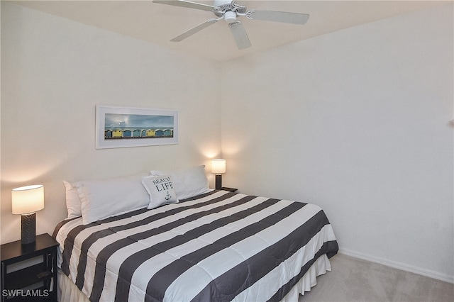 bedroom featuring ceiling fan and light carpet