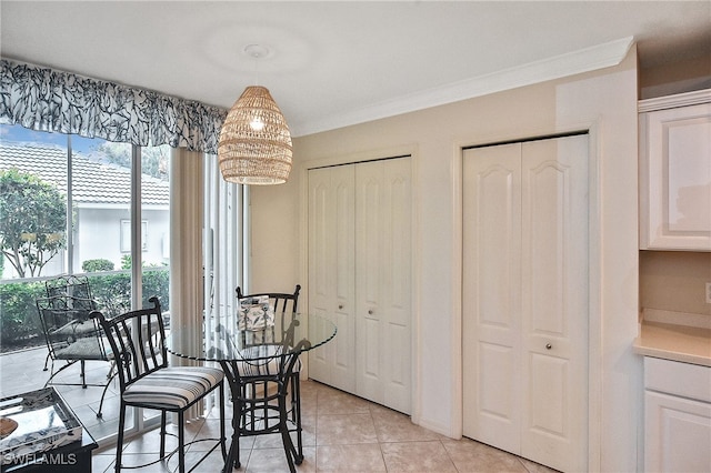 tiled dining space with ornamental molding