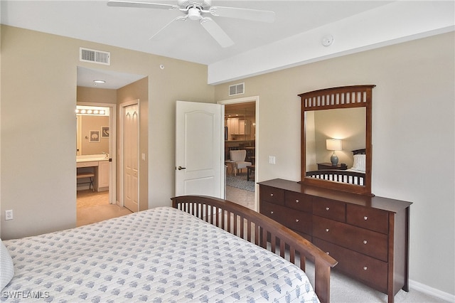 bedroom with ceiling fan and connected bathroom