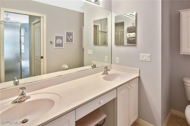 bathroom with tile patterned floors, toilet, and vanity