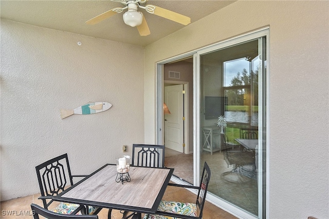 exterior space with ceiling fan