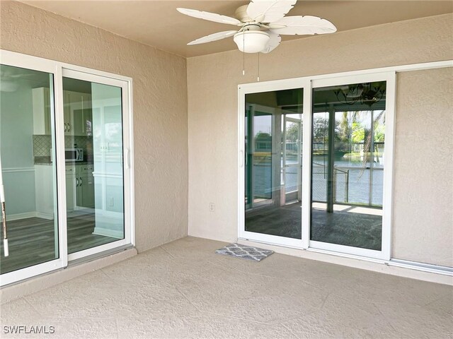 view of patio / terrace featuring ceiling fan