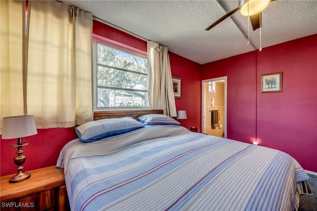 bedroom featuring ceiling fan and a textured ceiling