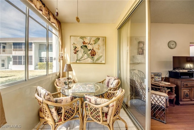 sunroom / solarium featuring breakfast area