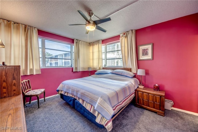 carpeted bedroom featuring a textured ceiling and ceiling fan