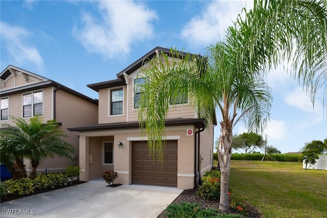 view of front of property with a front lawn and a garage