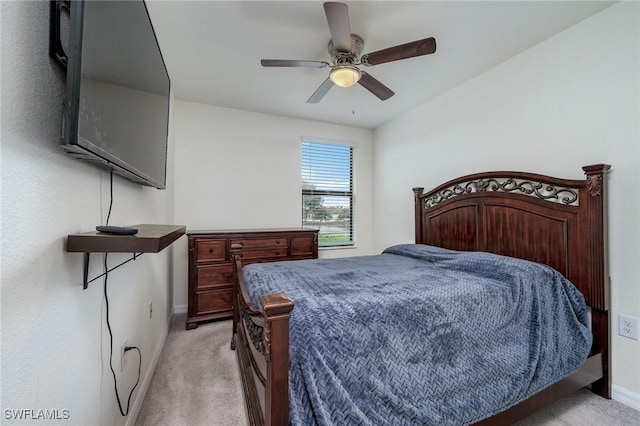 bedroom featuring ceiling fan and light colored carpet