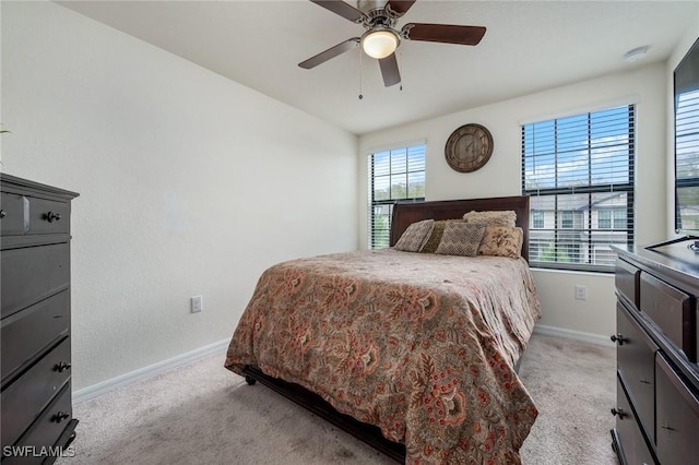 bedroom featuring ceiling fan and light colored carpet