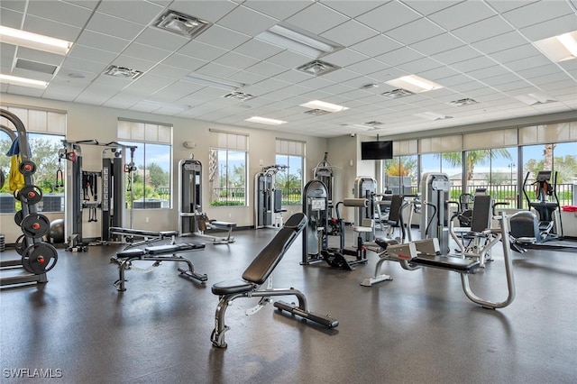 exercise room with a paneled ceiling