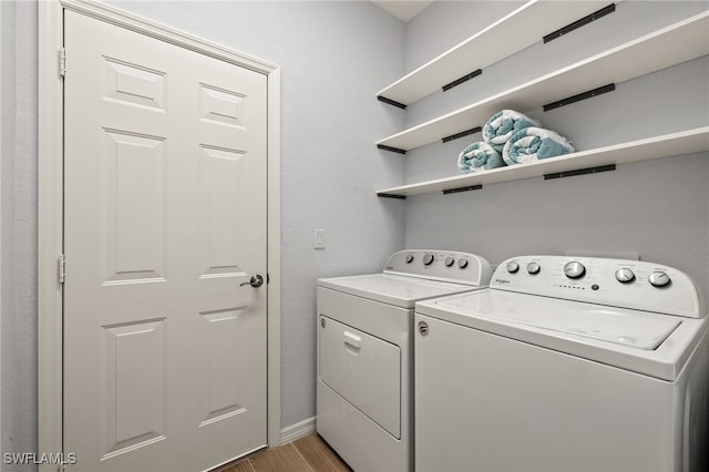 washroom with washing machine and dryer