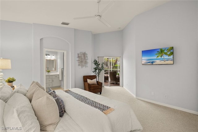 carpeted bedroom with ceiling fan and ensuite bath