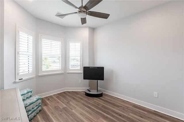 miscellaneous room featuring ceiling fan and wood-type flooring