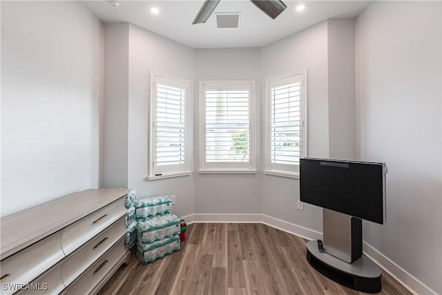 sitting room featuring ceiling fan and hardwood / wood-style flooring