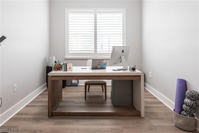 office with hardwood / wood-style flooring