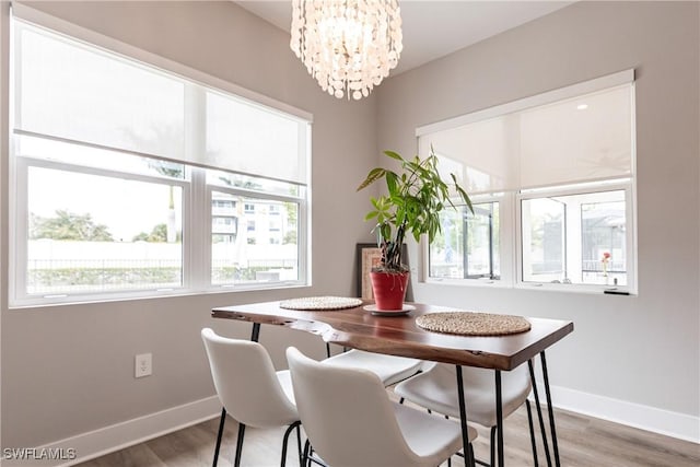 dining room with a chandelier and hardwood / wood-style floors