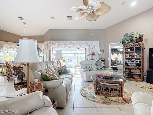 living room with ceiling fan and light tile patterned floors