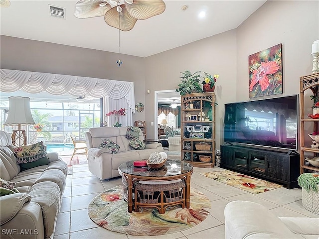 tiled living room featuring ceiling fan