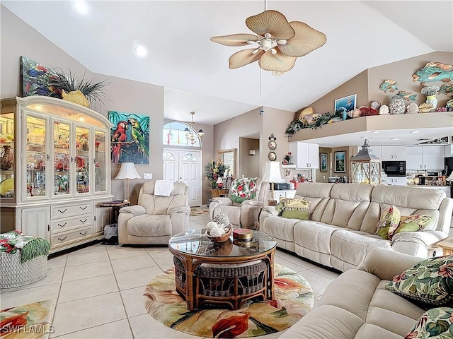 tiled living room featuring ceiling fan and high vaulted ceiling