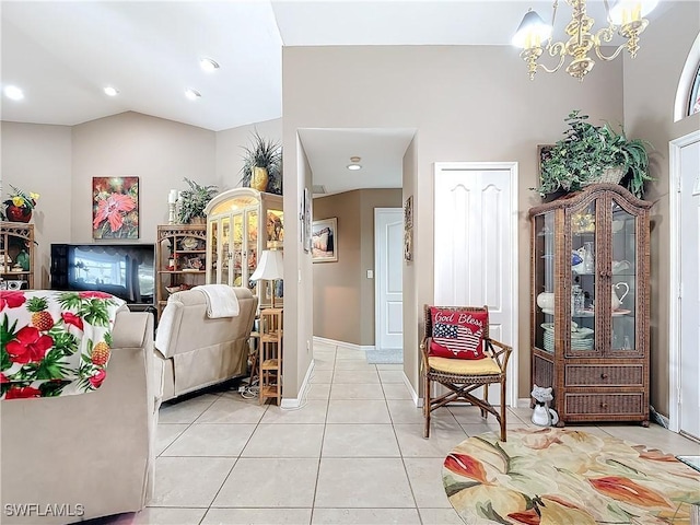 living room featuring lofted ceiling, an inviting chandelier, and light tile patterned flooring