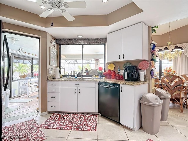 kitchen featuring white cabinets, dishwasher, ceiling fan with notable chandelier, and light tile patterned floors