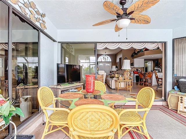 dining space with ceiling fan