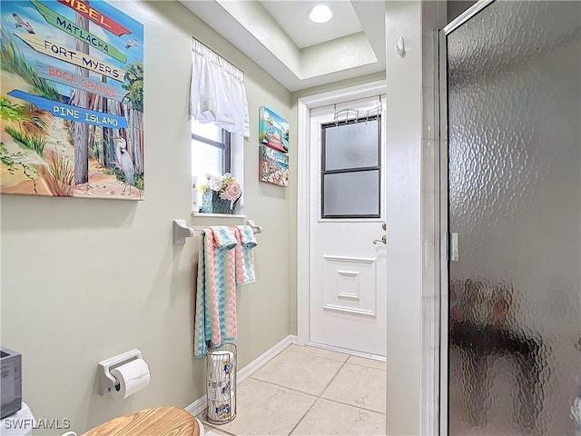 entryway with light tile patterned floors