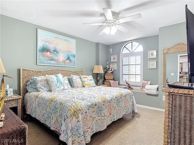 bedroom featuring ceiling fan and carpet