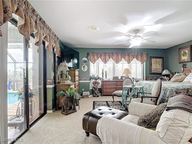 bedroom with ceiling fan, carpet, and access to outside