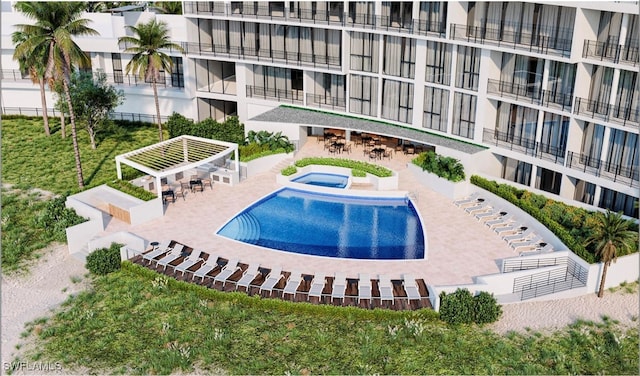 view of pool with a hot tub