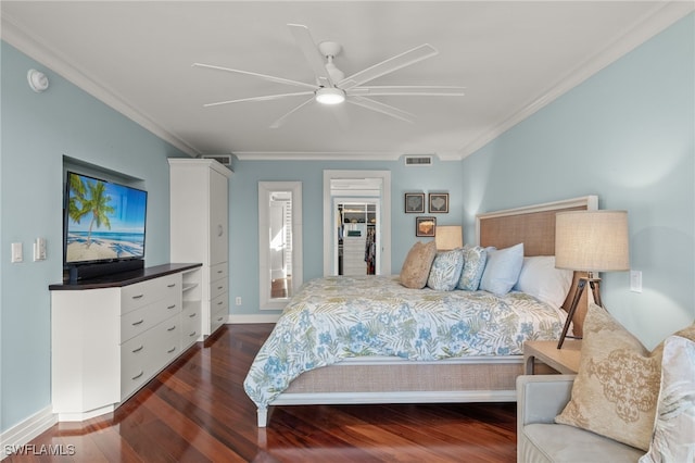 bedroom featuring ceiling fan, dark wood-type flooring, and crown molding