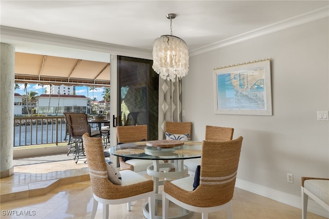 dining space with a water view, light tile patterned flooring, an inviting chandelier, and ornamental molding