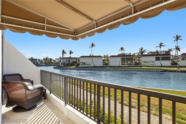 balcony featuring a water view